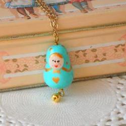 Children necklace with Matryoshka charm in sky blue and gold, babushka polymer clay, girl jewelry